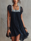 Apolline | Mini Dress in Embroidered Navy Blue Floral Mousseline