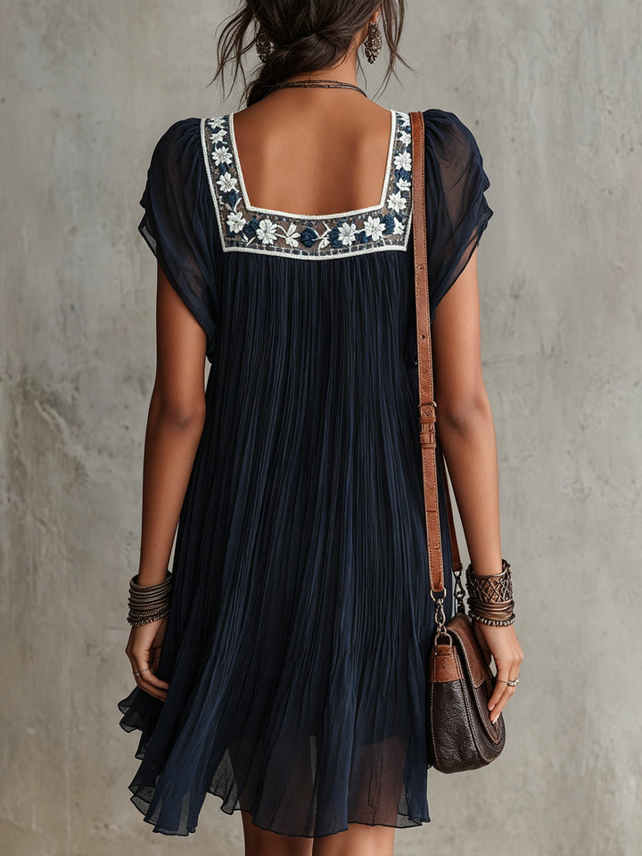 Apolline | Mini Dress in Embroidered Navy Blue Floral Mousseline